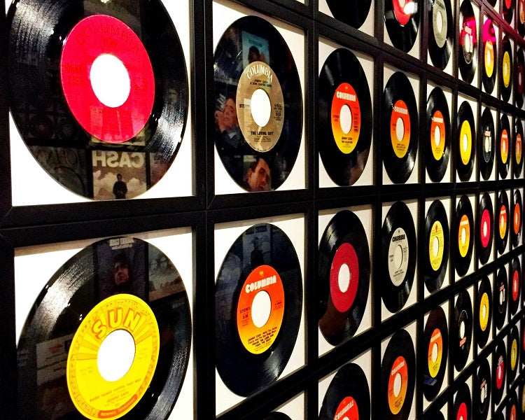 A wall of custom vinyl records